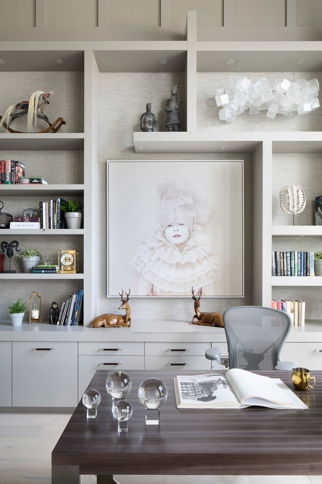 Example of a large transitional freestanding desk light wood floor and beige floor study room design in Miami with gray walls