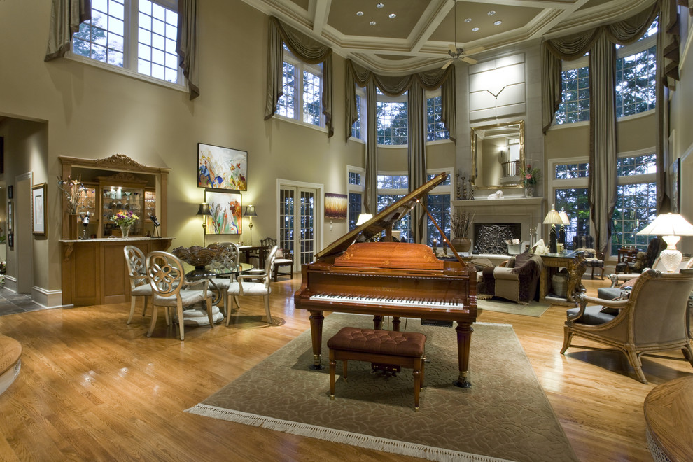 Foto de salón con rincón musical clásico extra grande sin televisor con suelo de madera en tonos medios y todas las chimeneas
