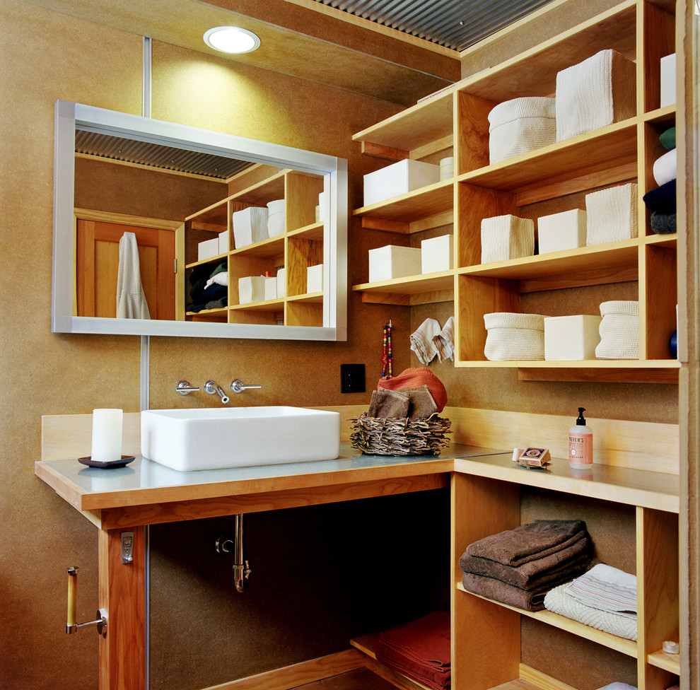 Photo of a small contemporary 3/4 bathroom in Denver with open cabinets, light wood cabinets, a vessel sink and brown walls.