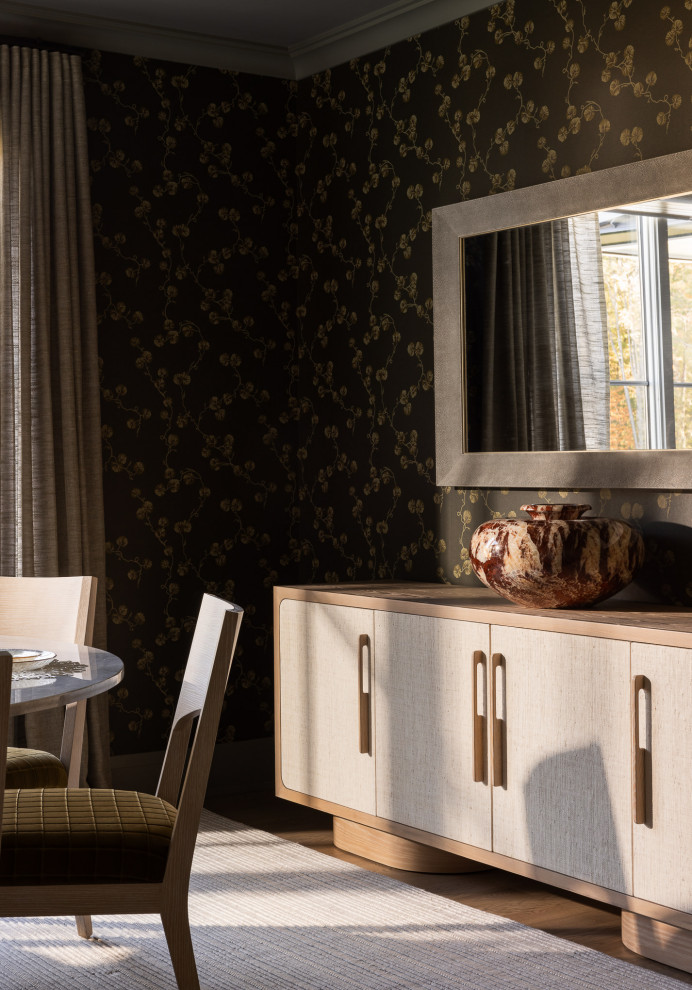 Inspiration for a mid-sized transitional medium tone wood floor and wallpaper enclosed dining room remodel in New York