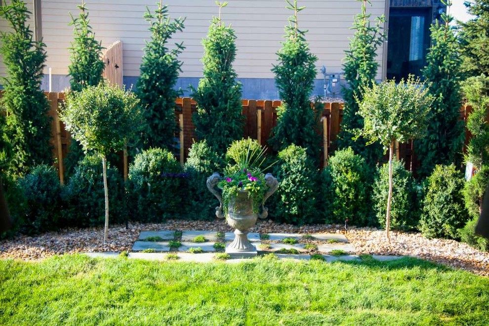 Photo of a small rustic partial sun backyard stone landscaping in Denver for summer.