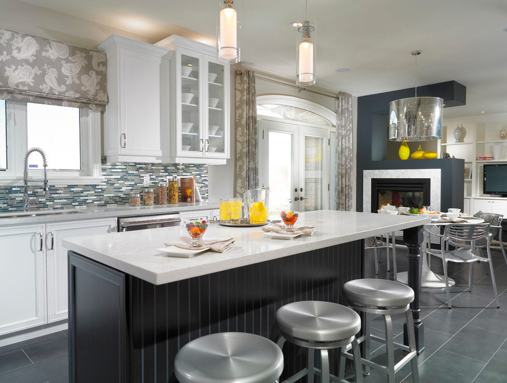 Contemporary kitchen in Toronto with recessed-panel cabinets, matchstick tile splashback, multi-coloured splashback, white cabinets and quartz benchtops.