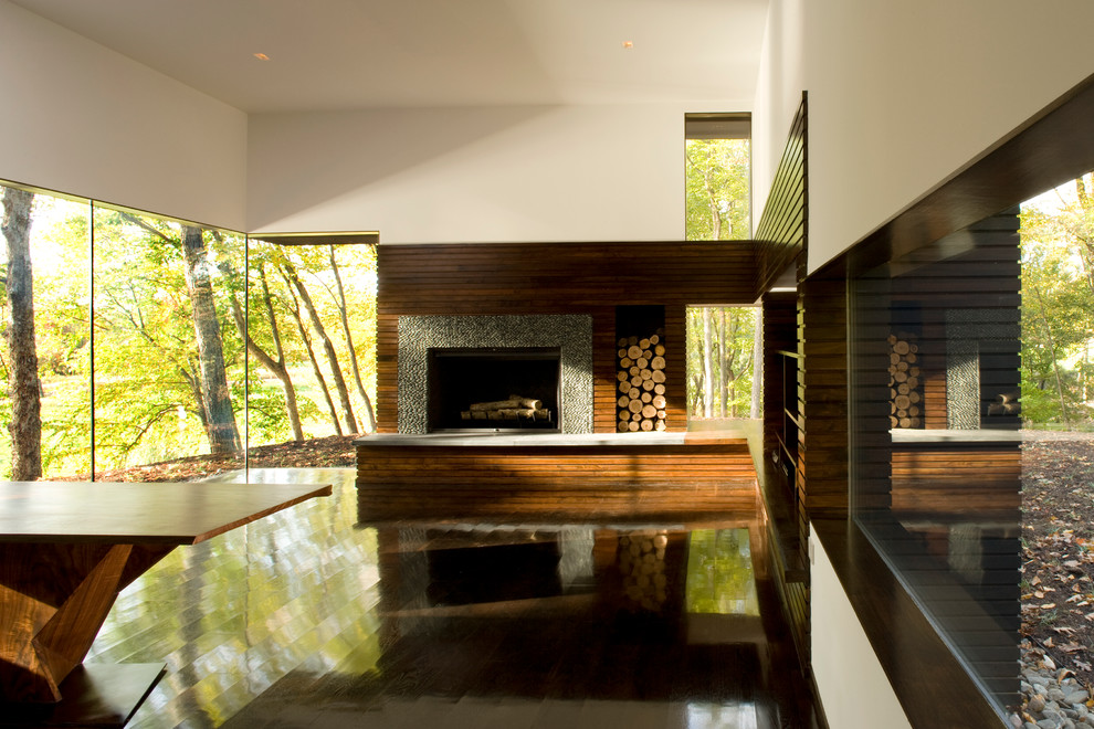 This is an example of a modern living room in New York with dark hardwood floors.