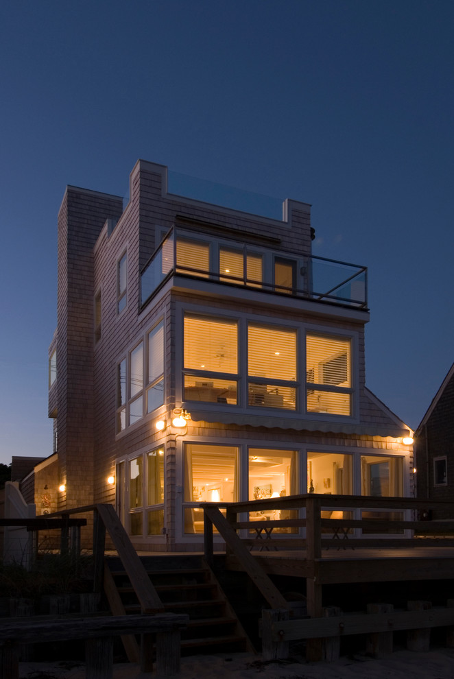 Design ideas for a large contemporary three-storey brown house exterior in Boston with wood siding.