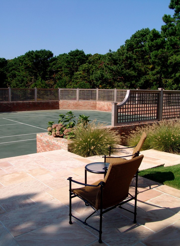 Design ideas for a large traditional backyard partial sun outdoor sport court in New York with concrete pavers and with outdoor playset.