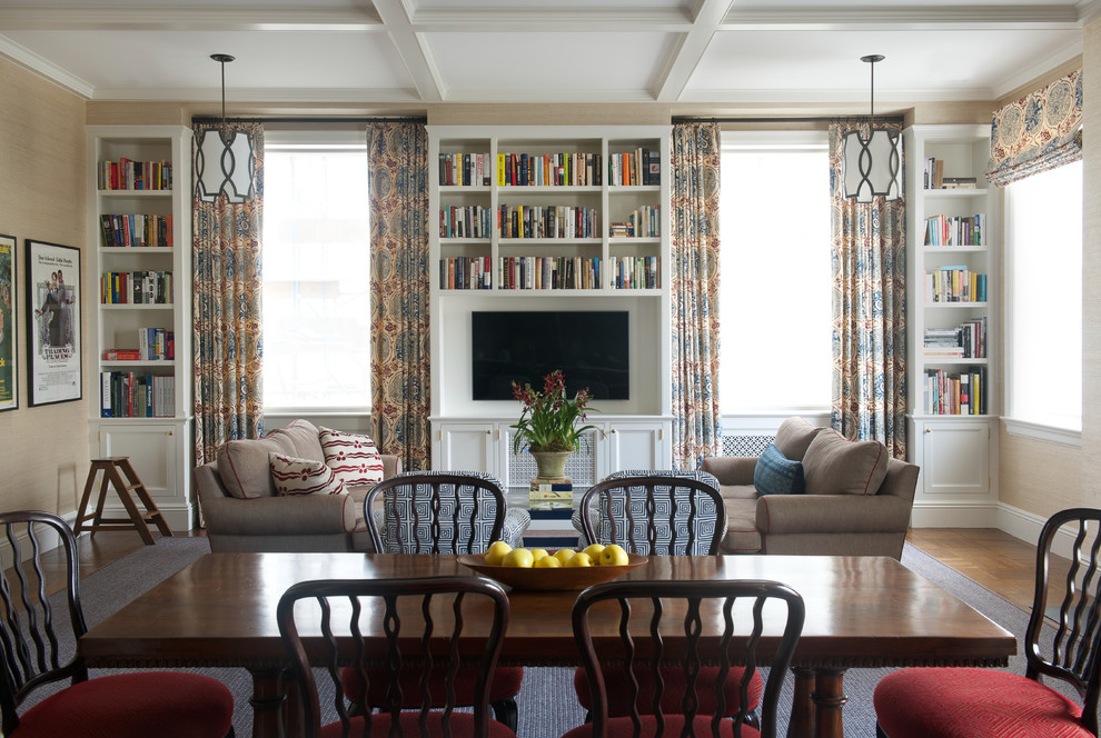 Elegant open concept medium tone wood floor family room library photo in New York with beige walls and a media wall