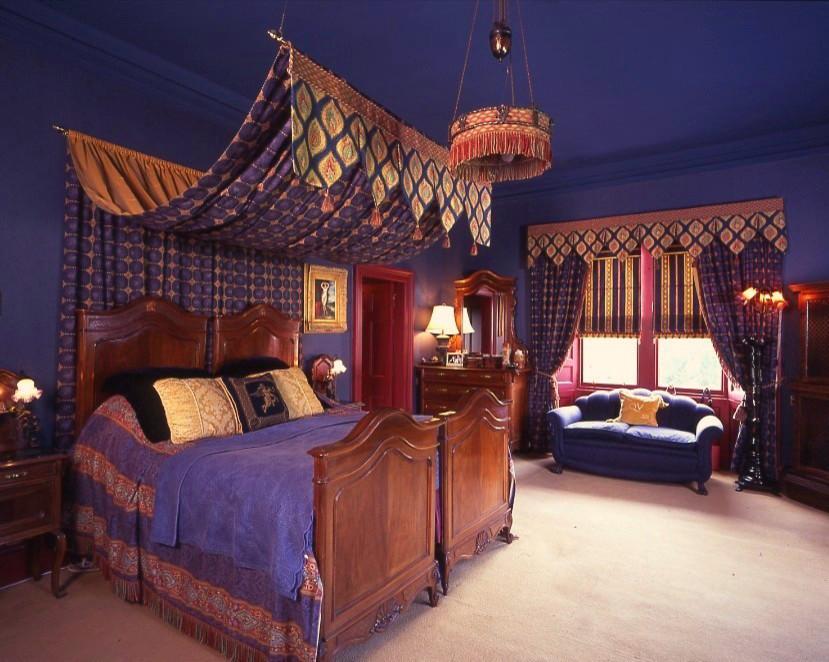 Design ideas for a large traditional master bedroom in Other with blue walls and carpet.