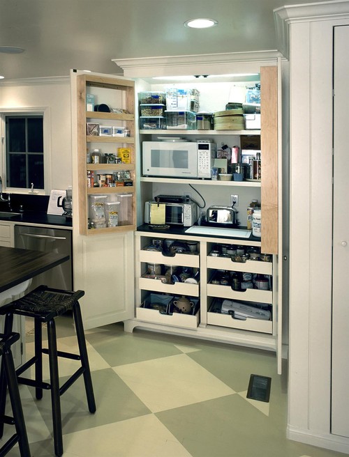 kitchen pantry with integrated appliance storage