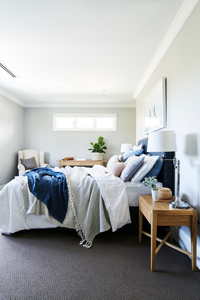 Design ideas for a mid-sized transitional master bedroom in Sydney with grey walls, carpet, no fireplace and grey floor.