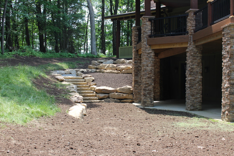 This is an example of a rustic shade side yard retaining wall landscape.