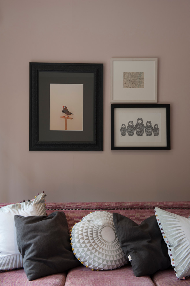 Eclectic living room in Belfast with pink walls.