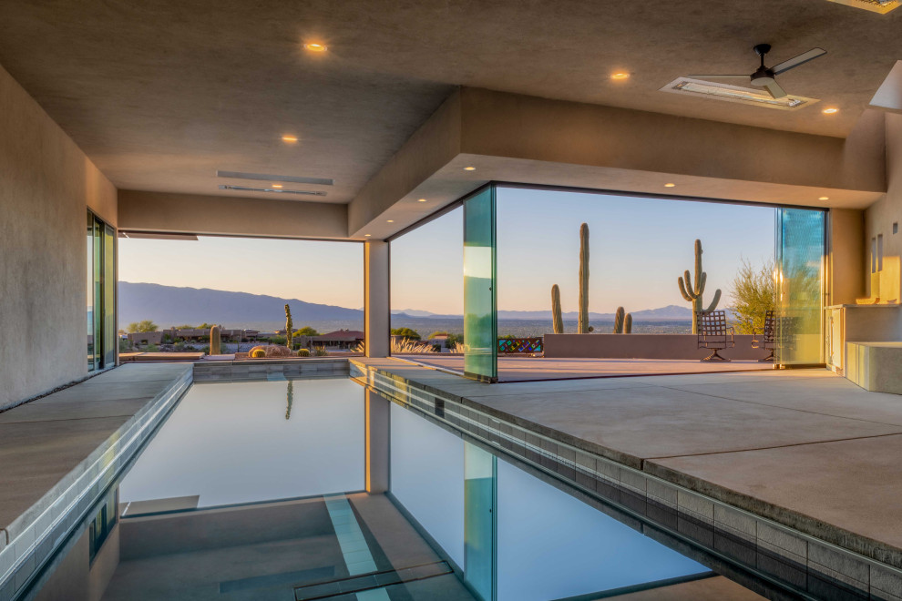 Inspiration for a southwestern concrete and rectangular lap pool remodel in Phoenix