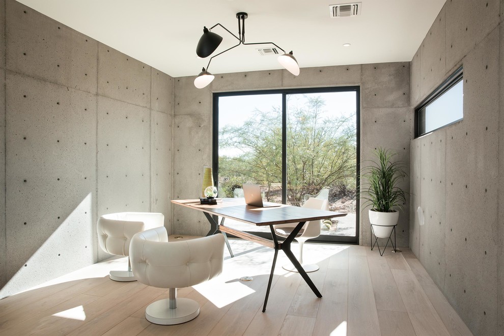 Inspiration for a study room in Phoenix with grey walls, light hardwood floors, no fireplace, a freestanding desk and beige floor.