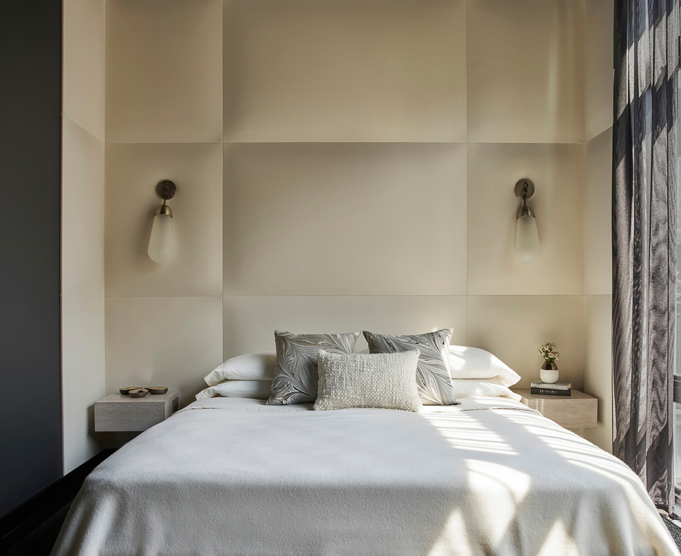 Photo of a contemporary bedroom in Chicago with beige walls.