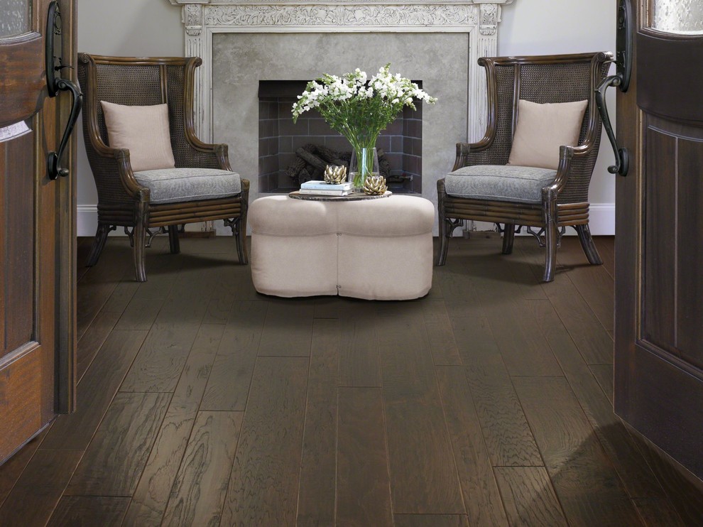 Inspiration for a transitional living room in Atlanta with dark hardwood floors.