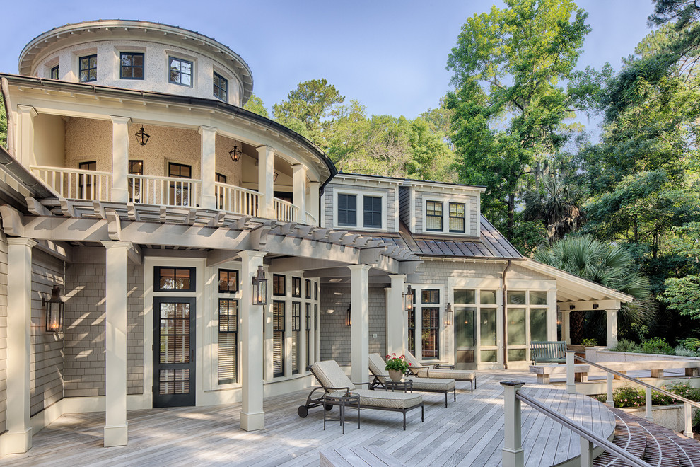 Design ideas for a traditional two-storey beige exterior in Charleston with a gable roof.