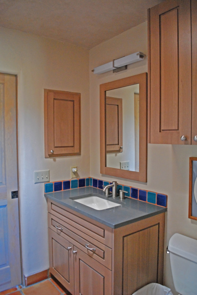 Inspiration for a small 3/4 bathroom in Albuquerque with raised-panel cabinets, light wood cabinets, multi-coloured tile, ceramic tile, white walls, an undermount sink and quartzite benchtops.