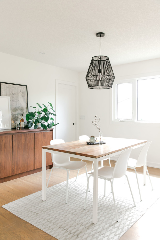 This is an example of a small contemporary dining room in Calgary.