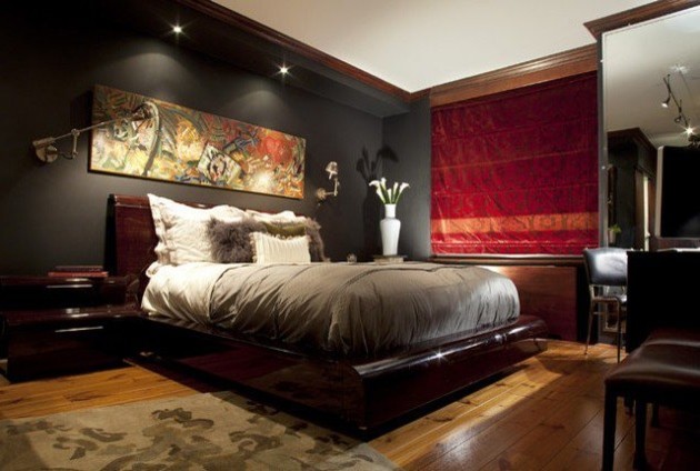This is an example of a contemporary master bedroom in Houston with grey walls and light hardwood floors.