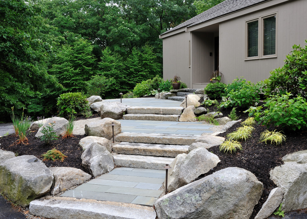 This is an example of a mid-sized traditional front yard garden in Boston with natural stone pavers.