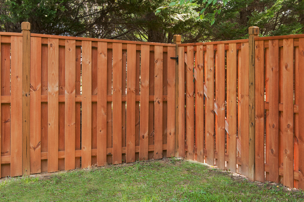 This is an example of a back garden in Atlanta with a wood fence.
