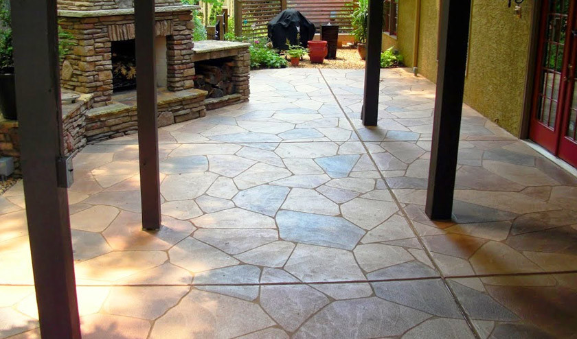 This is an example of an arts and crafts backyard patio in Dallas with concrete pavers.