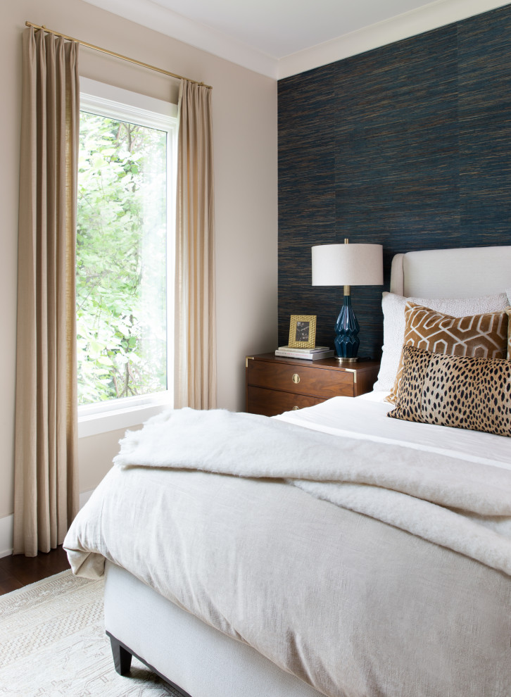Inspiration for a transitional master bedroom in Austin with blue walls, medium hardwood floors, brown floor and wallpaper.