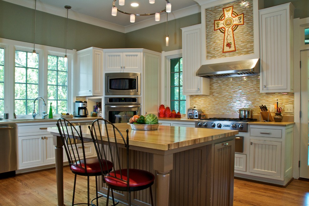 Traditional kitchen in Nashville with stainless steel appliances and wood benchtops.