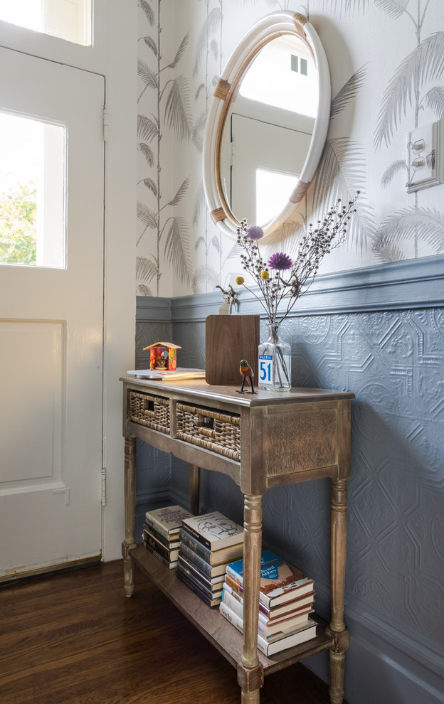 Inspiration for a small eclectic medium tone wood floor entryway remodel in San Francisco with gray walls and a white front door