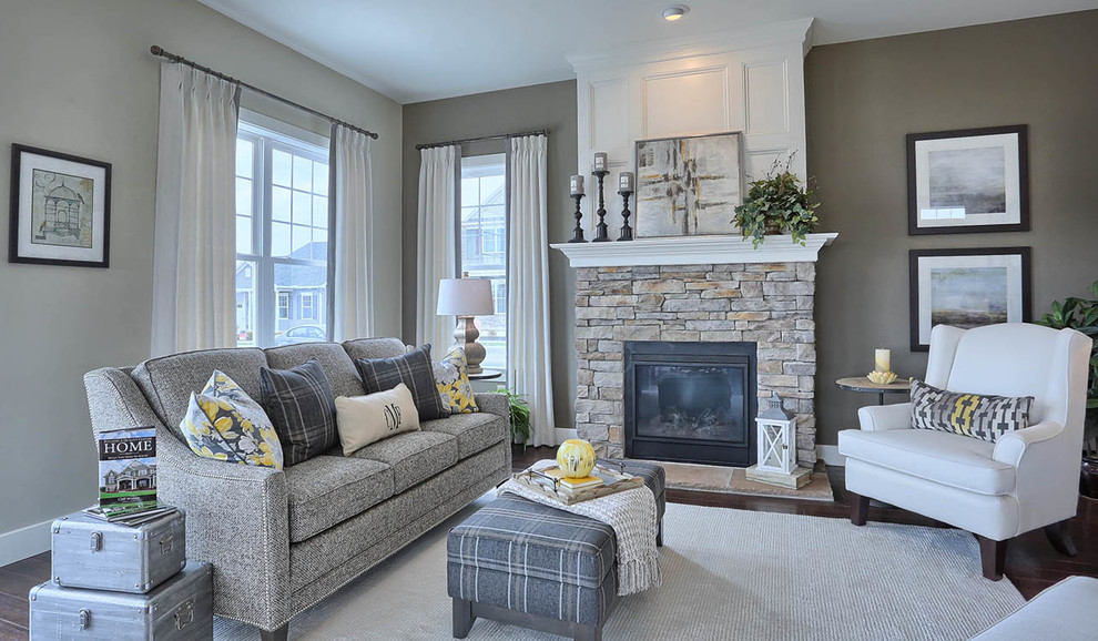 Design ideas for a mid-sized arts and crafts open concept family room in Other with grey walls, dark hardwood floors, a standard fireplace, a stone fireplace surround and no tv.