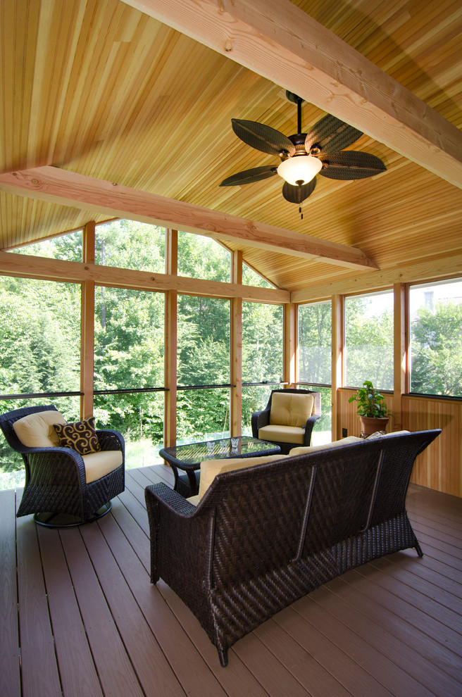 Inspiration for a mid-sized traditional sunroom in Manchester with dark hardwood floors, no fireplace and a standard ceiling.