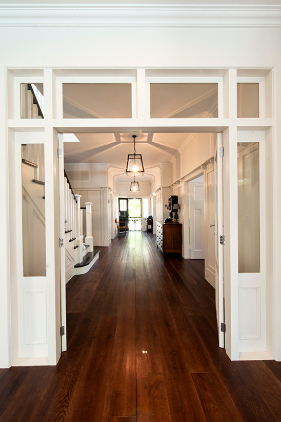 Design ideas for a large contemporary entry hall in Melbourne with white walls, dark hardwood floors, a double front door and a white front door.