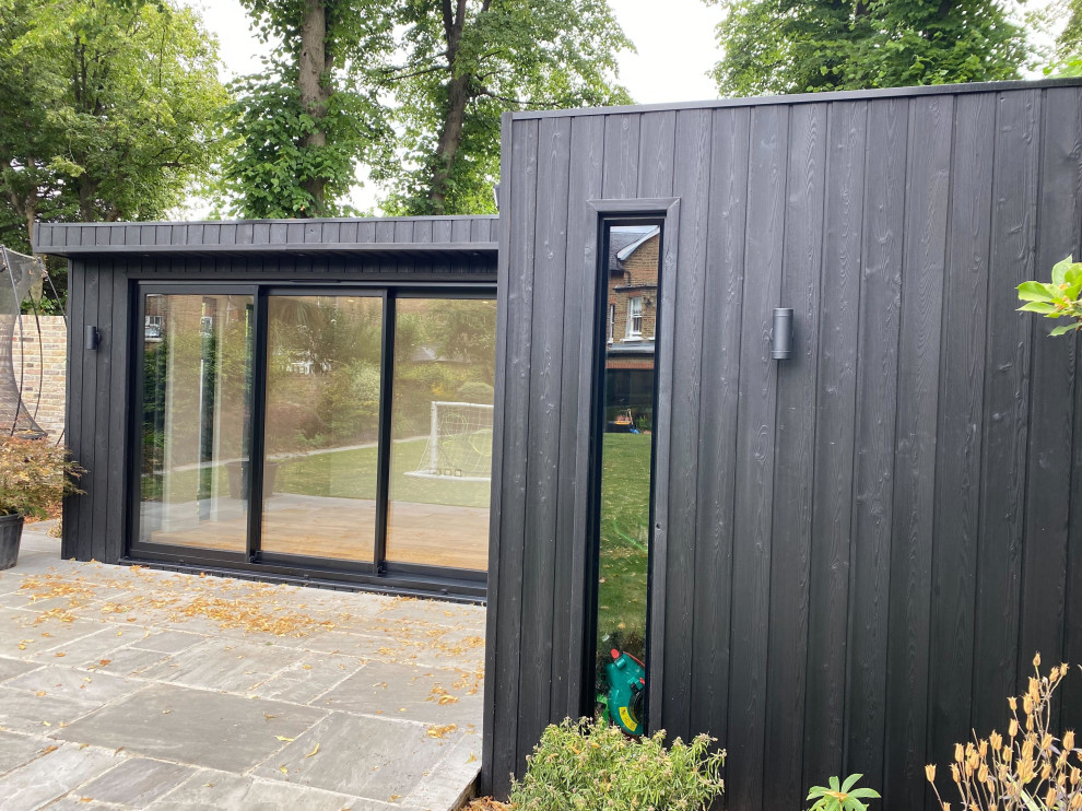 Design ideas for a mid-sized contemporary shed and granny flat in Surrey.