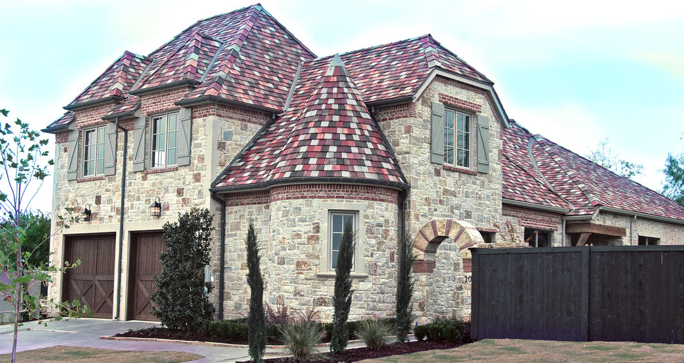 Design ideas for a mid-sized mediterranean two-storey exterior in Dallas with stone veneer.