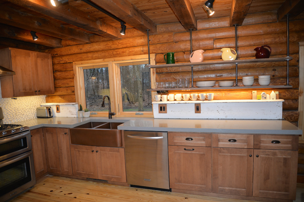 Mid-sized mountain style galley light wood floor open concept kitchen photo in Grand Rapids with an undermount sink, recessed-panel cabinets, medium tone wood cabinets, solid surface countertops, white backsplash, stainless steel appliances and an island