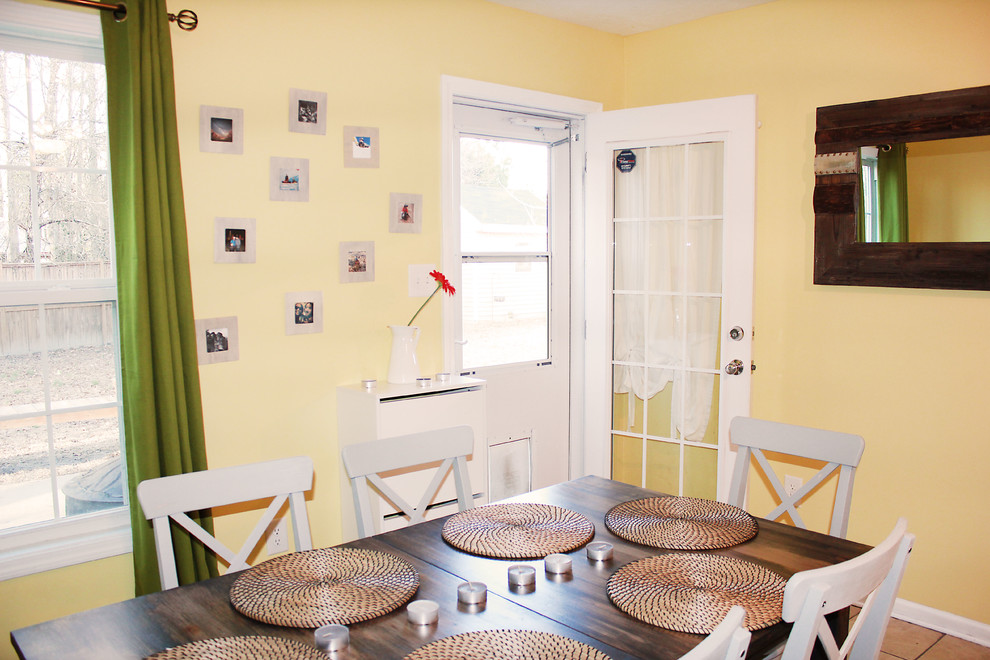 Inspiration for a small rustic ceramic tile kitchen/dining room combo remodel in Raleigh with yellow walls and no fireplace