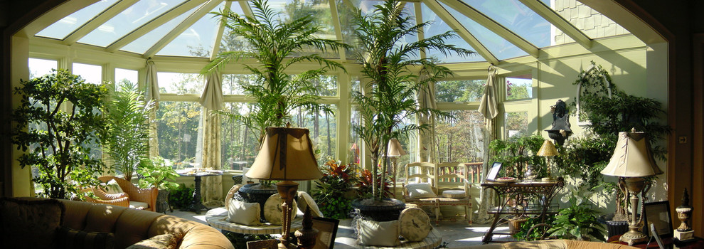 This is an example of a mid-sized traditional sunroom in Atlanta with concrete floors, no fireplace and a skylight.