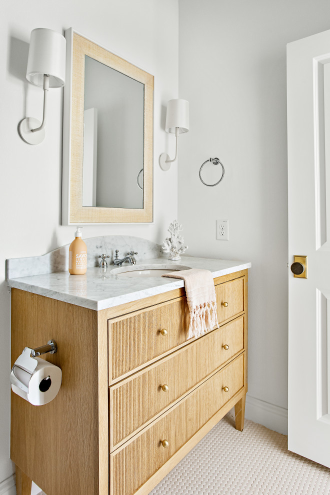 This is an example of an expansive transitional kids bathroom in Dallas with shaker cabinets, light wood cabinets, an alcove tub, a shower/bathtub combo, a two-piece toilet, white tile, white walls, porcelain floors, white floor, a shower curtain, grey benchtops, a single vanity, a freestanding vanity and an undermount sink.