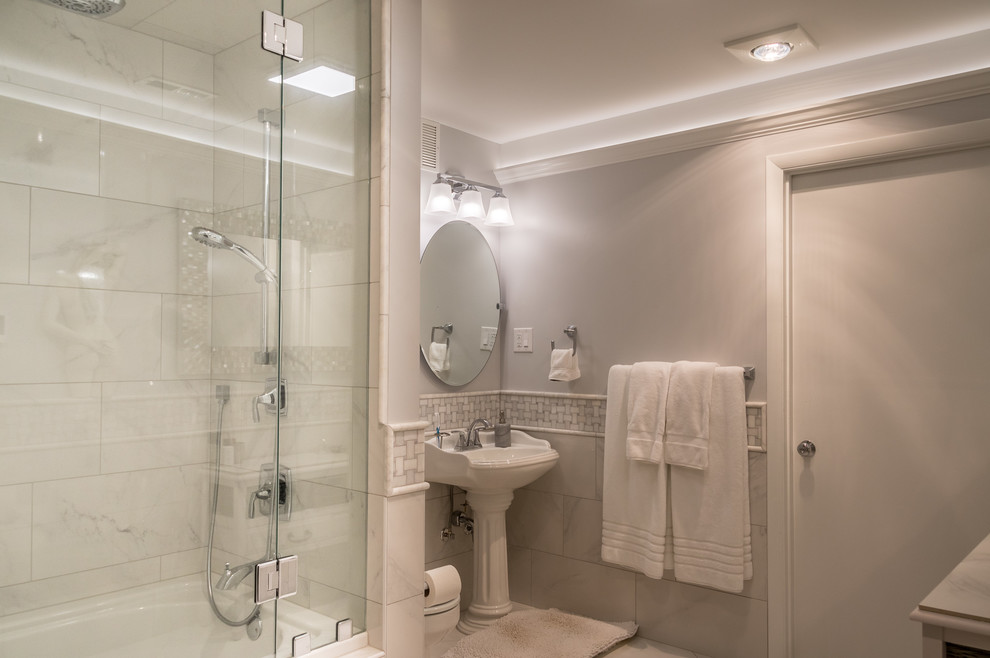 Design ideas for a mid-sized transitional master bathroom in Other with a drop-in tub, a shower/bathtub combo, white tile, ceramic tile, beige walls, ceramic floors, a pedestal sink, granite benchtops, white floor, a hinged shower door and white benchtops.