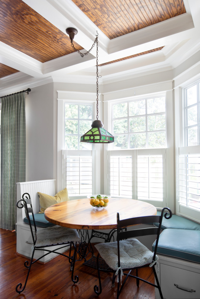 Mid-sized traditional open plan dining in Other with coffered.