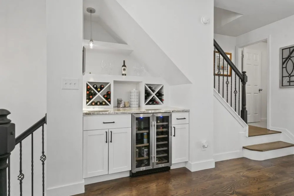 Built-in wine bar beneath stairs