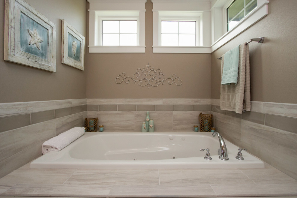 Design ideas for a beach style master bathroom in Other with an undermount sink, shaker cabinets, white cabinets, granite benchtops, a drop-in tub, a double shower, a two-piece toilet, gray tile, ceramic tile, beige walls and ceramic floors.