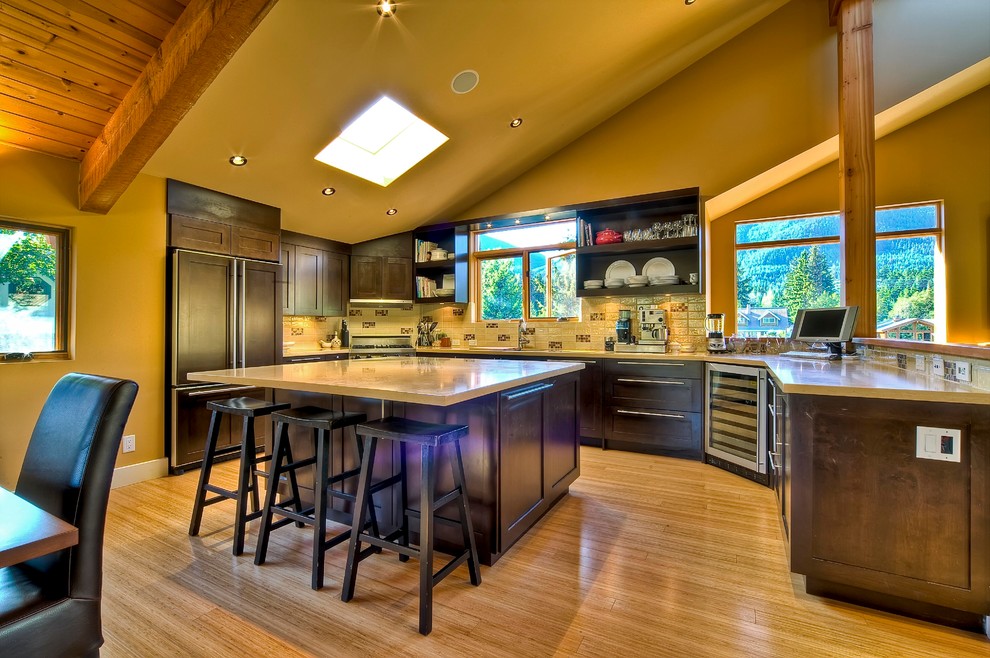 Large contemporary u-shaped eat-in kitchen in Vancouver with an undermount sink, shaker cabinets, dark wood cabinets, quartz benchtops, yellow splashback, ceramic splashback, panelled appliances, bamboo floors and with island.