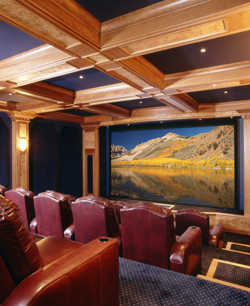 Inspiration for a mid-sized country open concept home theatre in Denver with carpet and a built-in media wall.