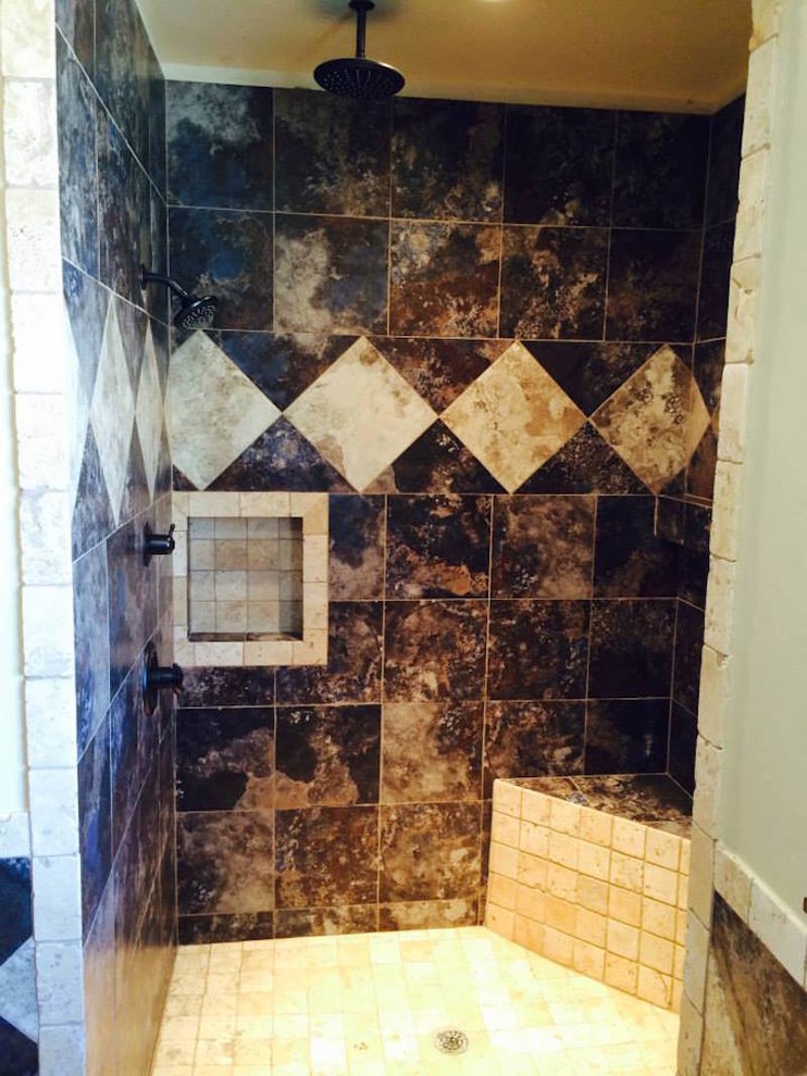 Inspiration for a marble floor doorless shower remodel in Oklahoma City with medium tone wood cabinets and granite countertops