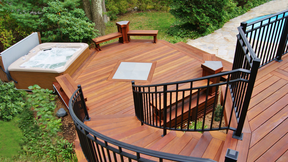 Photo of a large contemporary backyard deck in New York with no cover.