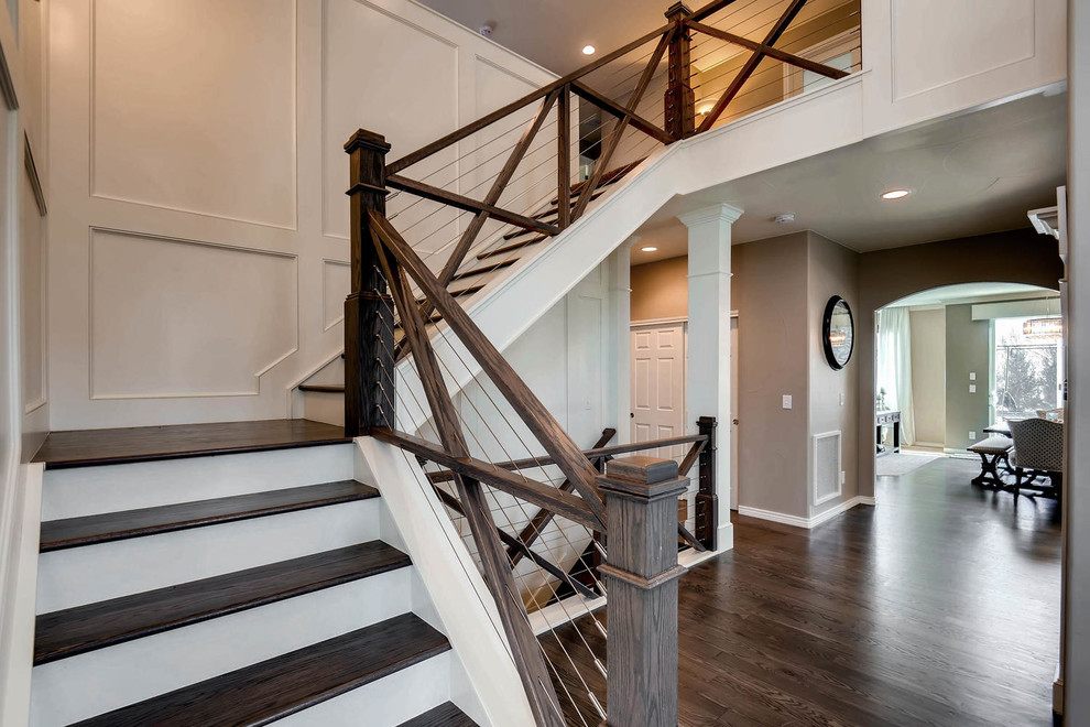 Design ideas for a mid-sized contemporary wood l-shaped staircase in Denver with wood risers and wood railing.