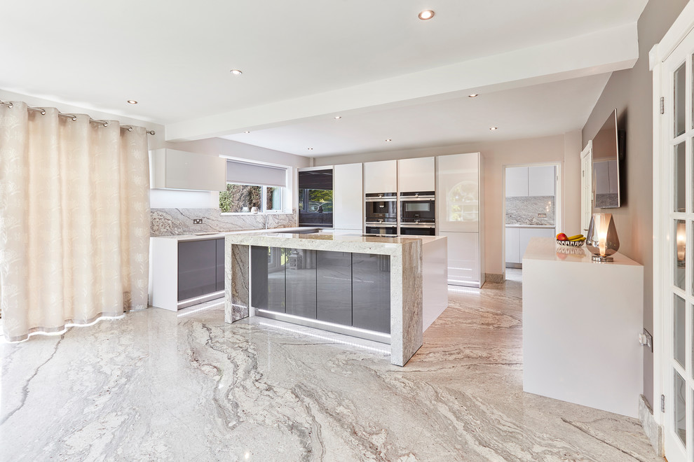 Photo of a mid-sized contemporary u-shaped eat-in kitchen in Other with an integrated sink, flat-panel cabinets, white cabinets, quartzite benchtops, grey splashback, stone slab splashback, black appliances, marble floors, with island, grey floor, white benchtop and coffered.