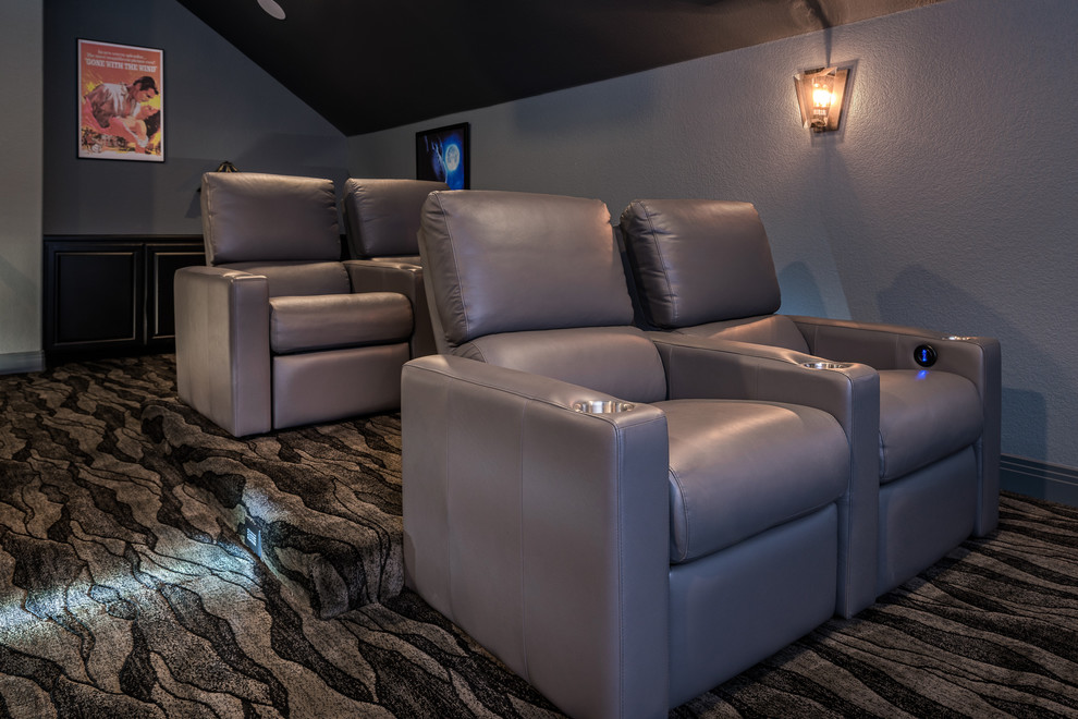 Photo of a large contemporary enclosed home theatre in Dallas with grey walls, carpet, a projector screen and grey floor.