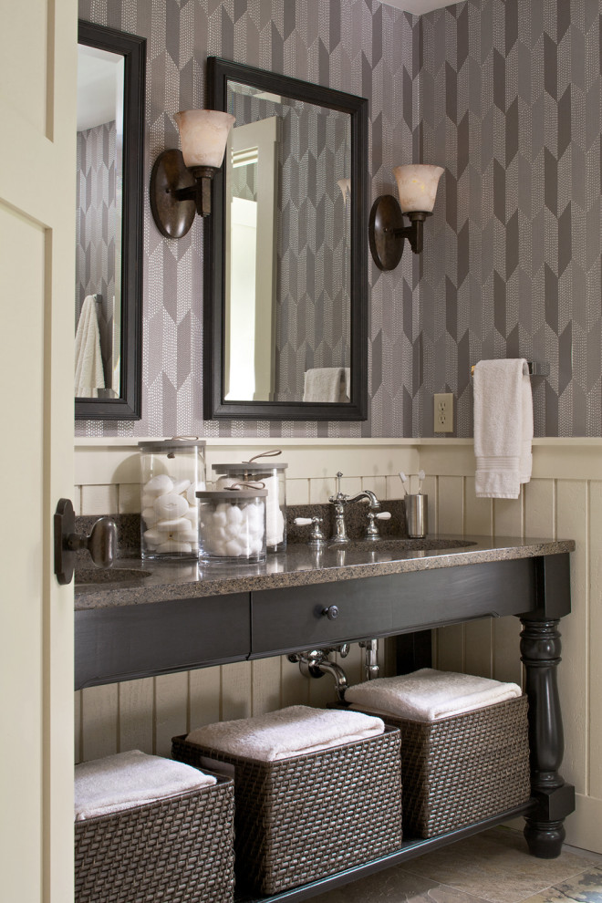 Photo of a country bathroom in Other with dark wood cabinets, grey walls, an undermount sink, grey floor and brown benchtops.